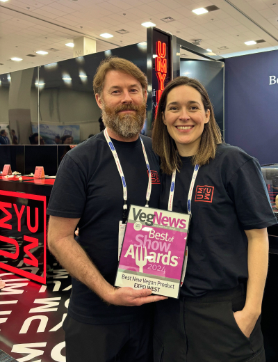 UMYUM team members holding the Best New Vegan Product award at Expo West.