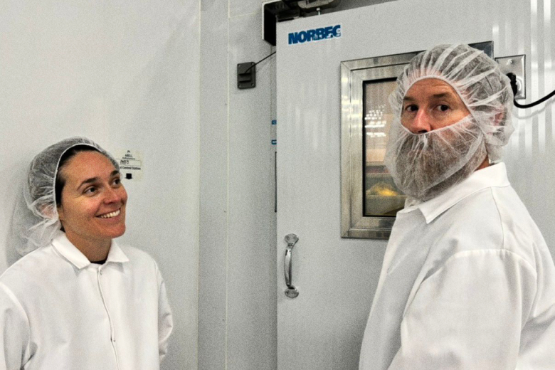 UMYUM founders Baz and Katherine touring a plantbased food production facility.